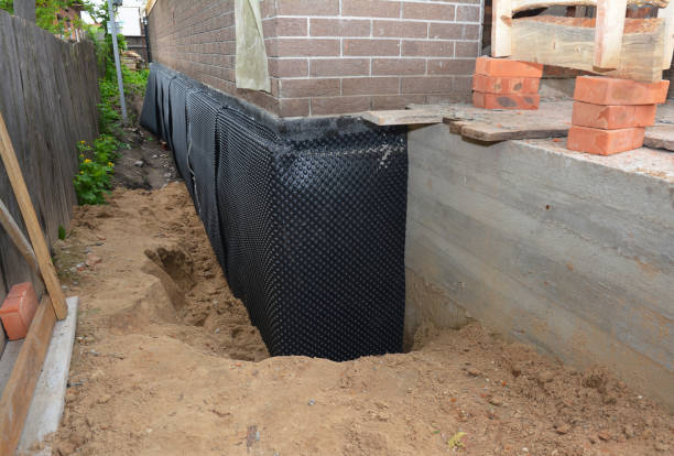 SJ Waterproofing Pros technician performing targeted Waterproofing assessment in Waterford, MI